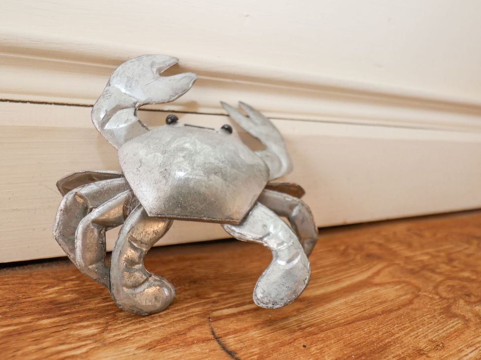 A crab figurine on the floor at Greenfingers in Whitby