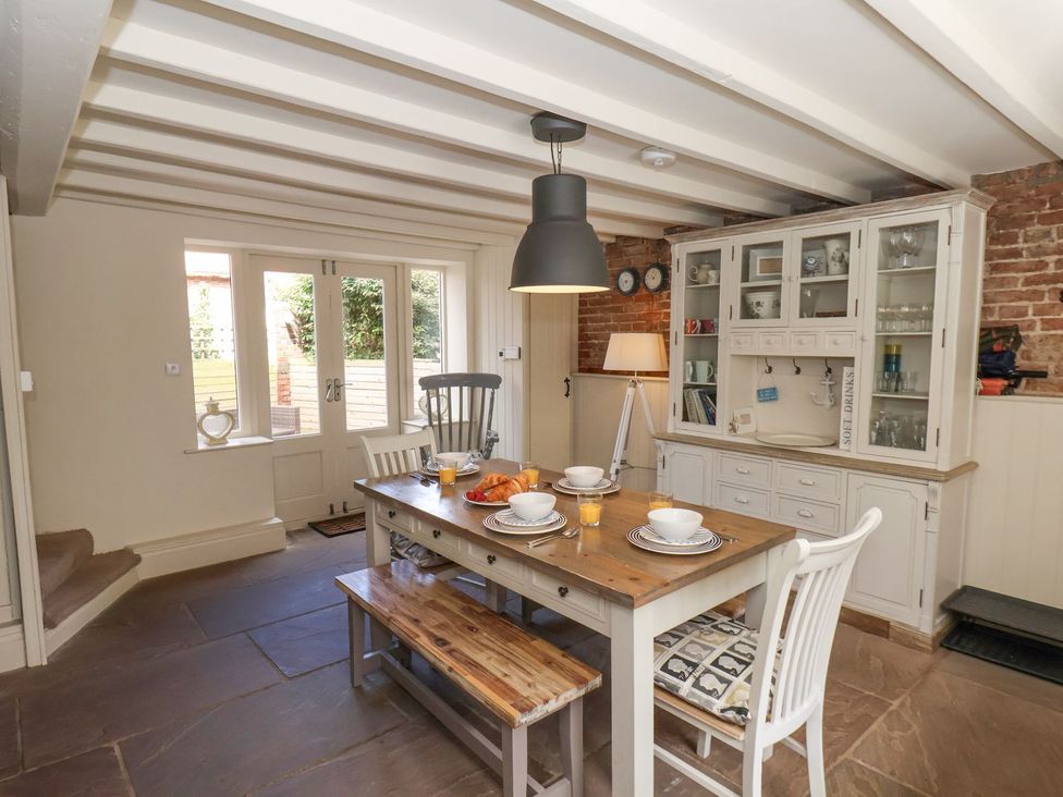 A kitchen with a dining table and chairs at Greenfingers in Whitby