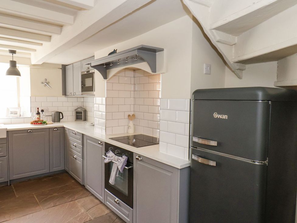 A kitchen with a fridge and oven at Greenfingers in Whitby