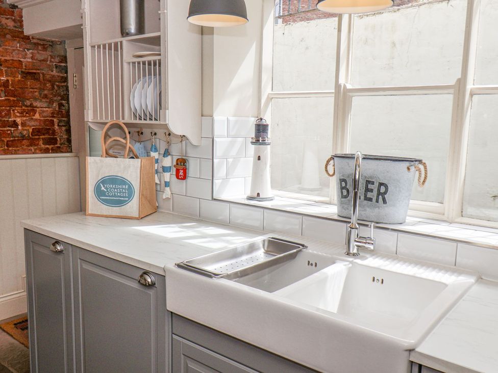 A kitchen with a sink and counter at Greenfingers in Whitby