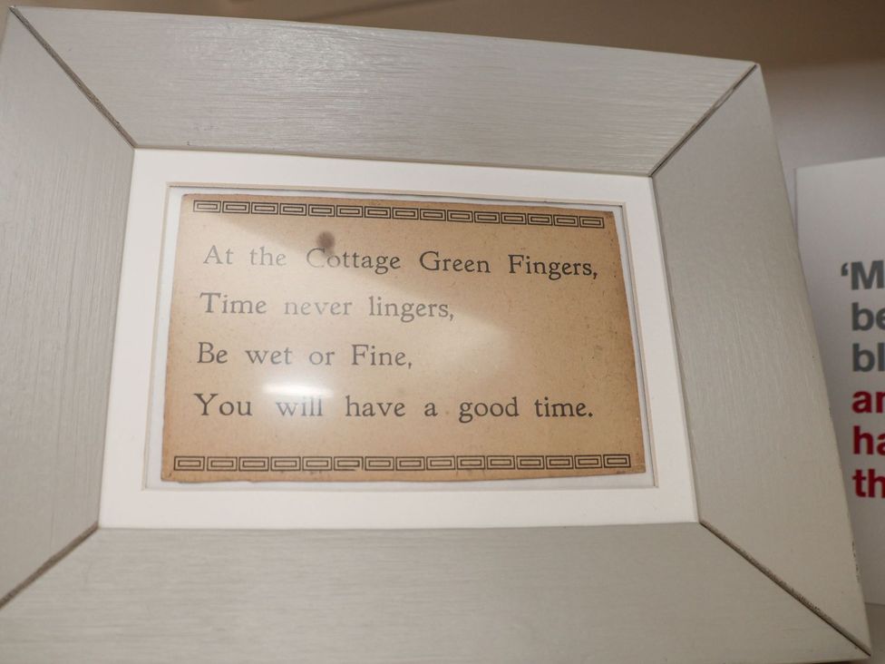 A framed print with a poem at Greenfingers in Whitby