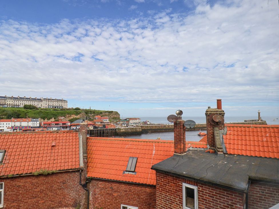 View of rooftops and harbor at Greenfingers in Whitby