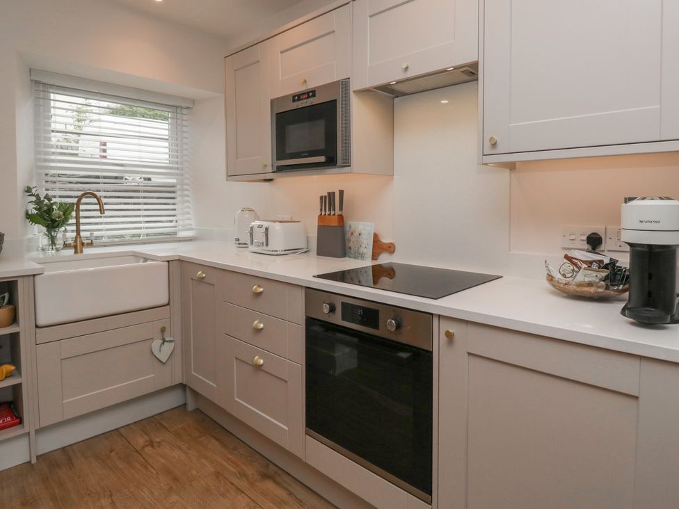 A kitchen with a sink and appliances at Wansfell Nook in Ambleside
