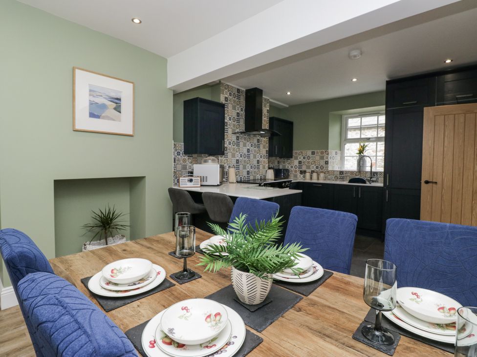 A dining area with chairs and table in Holy Trinity Cottage Millom
