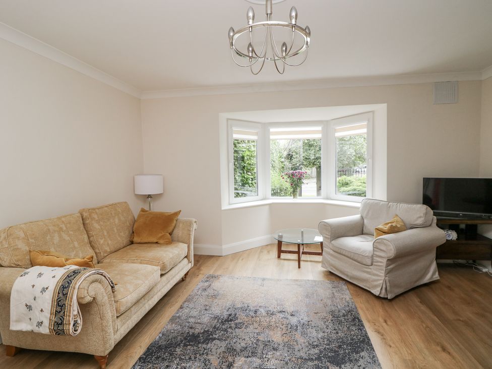 A living room with sofas and a television at 7 Belfort Court in 