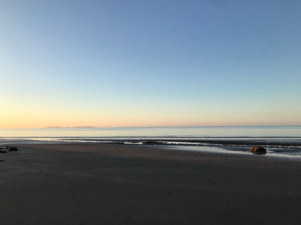A beach with ocean and sky at No.51 Llanteg Park Amroth