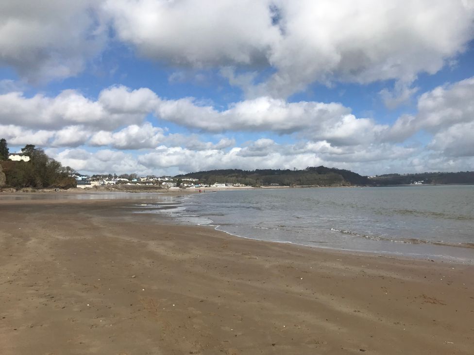 A beach scene with sand and water at No.51 Llanteg Park, Amroth