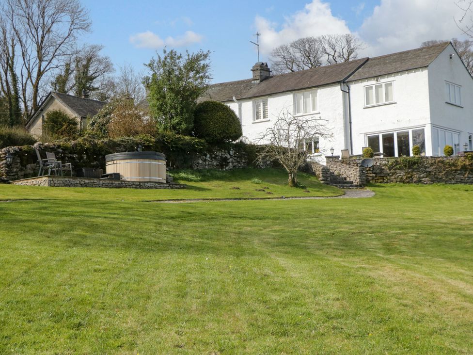 A house with a hot tub and garden at Barn Howe in Lyth near Levens