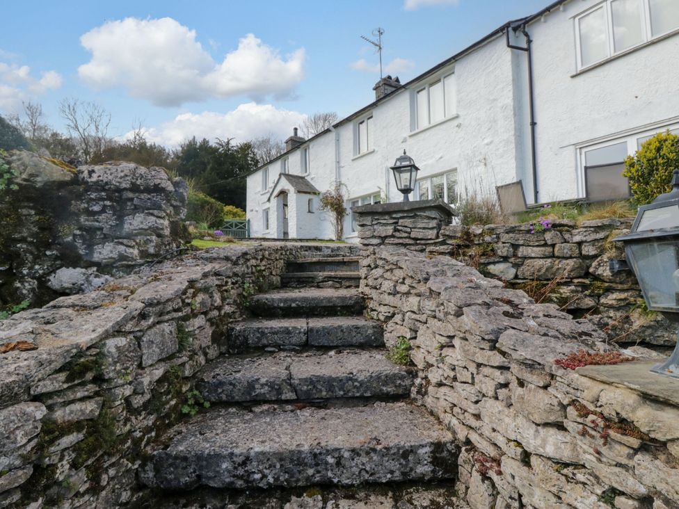 Steps leading to a house with stone walls at Barn Howe in Lyth near Levens