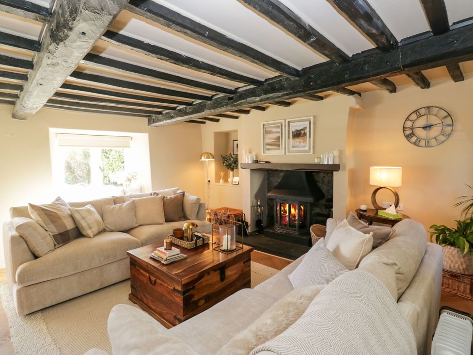 A living room with a sofa and coffee table at Barn Howe in Lyth near Levens