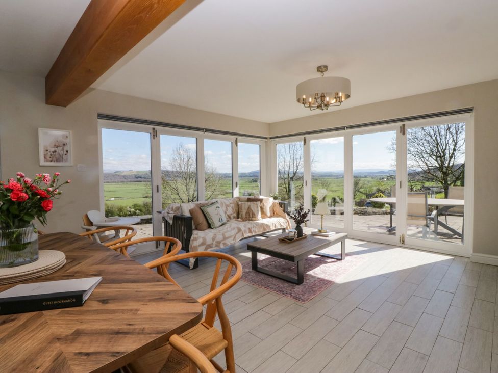A living room with a sofa and coffee table at Barn Howe Lyth near Levens