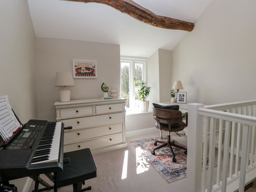 An office with a keyboard and a chair at Barn Howe in Lyth near Levens
