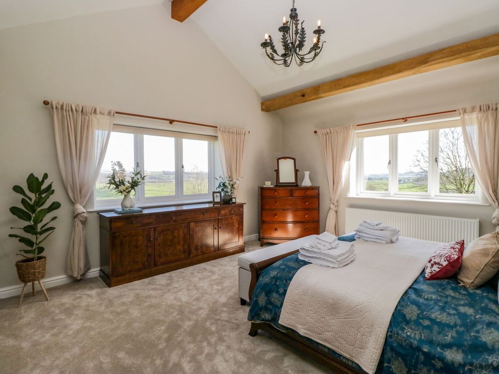 A bedroom with a bed and a chest of drawers at Barn Howe in Lyth near Levens