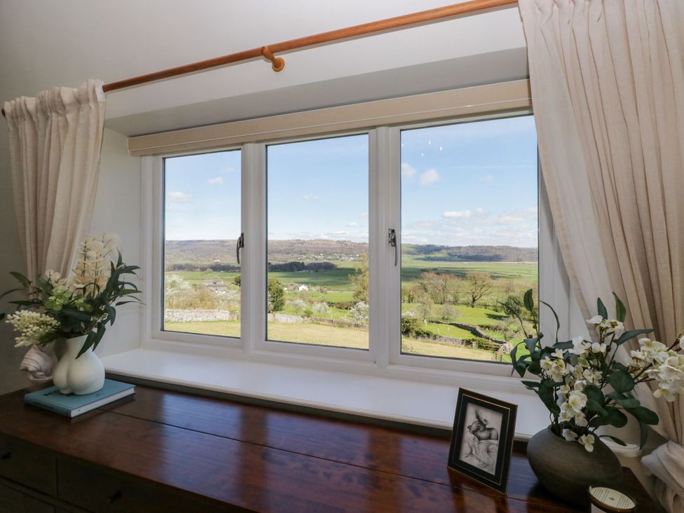 A window with views of a landscape at Barn Howe in Lyth near Levens