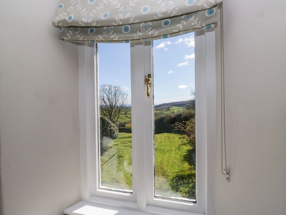 A window with a view of a garden at Barn Howe Lyth near Levens
