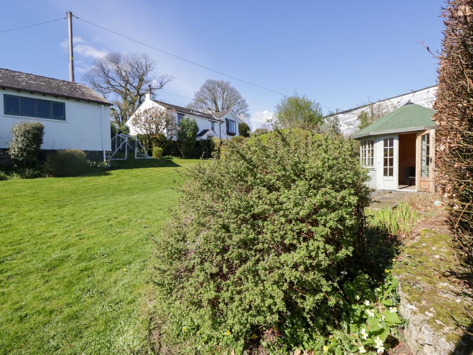 A garden with a bush and a gazebo at Barn Howe in Lyth near Levens