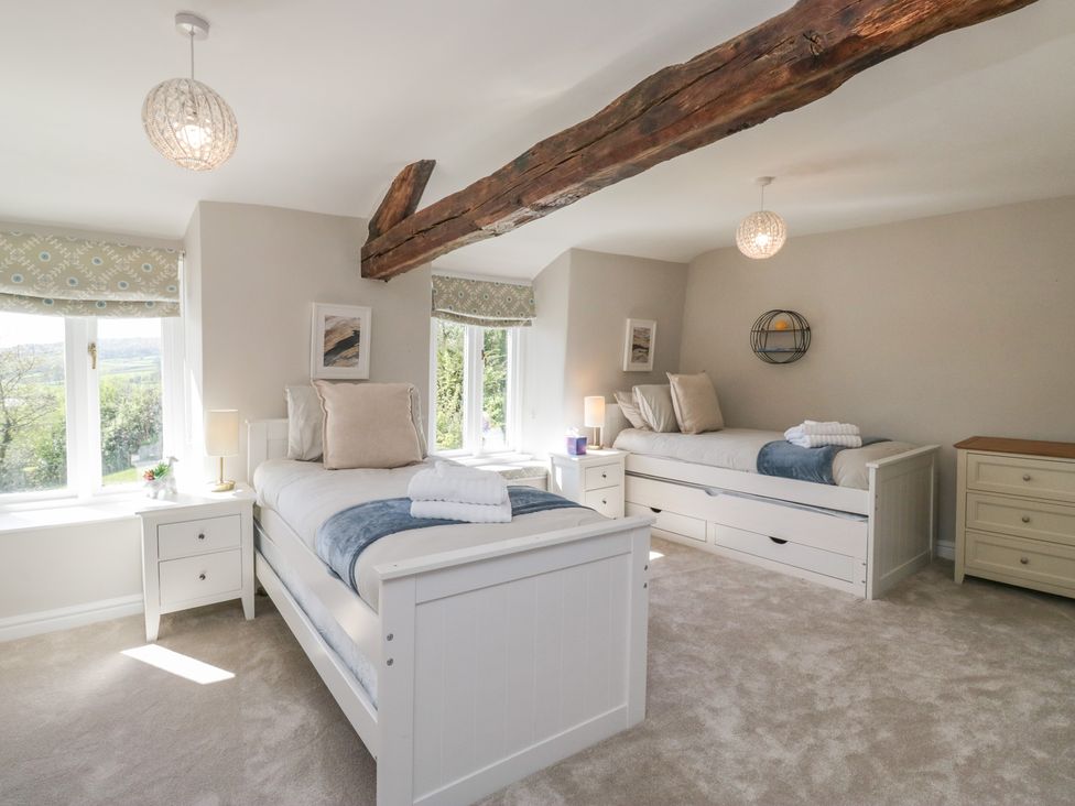 A bedroom with two beds at Barn Howe in Lyth near Levens