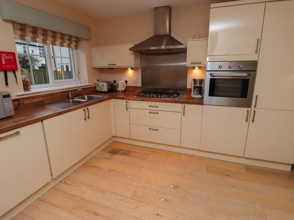 A kitchen with a sink and stove at High Sea View