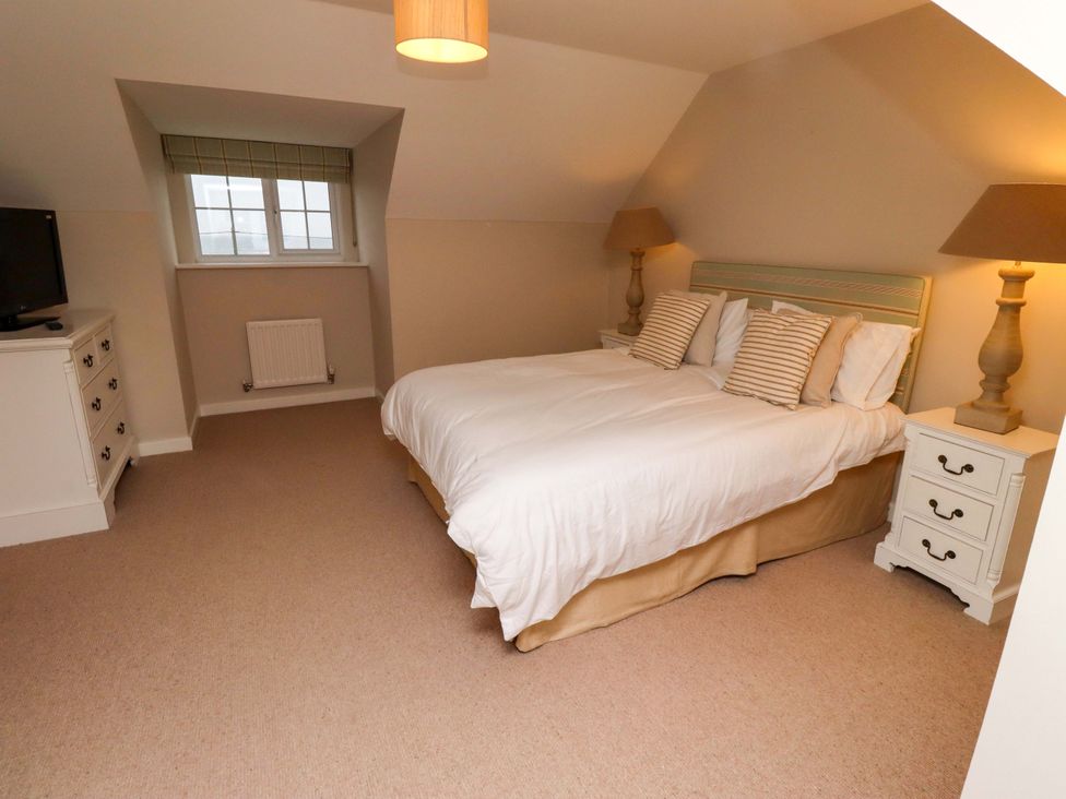 A bedroom with a bed and television at High Sea View