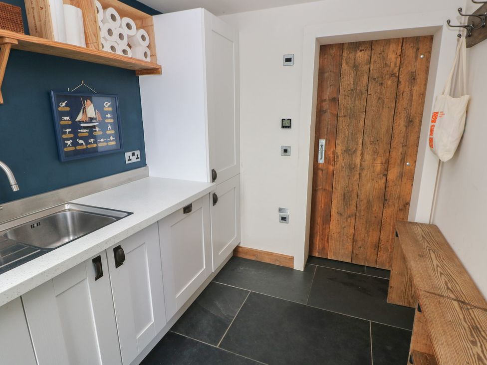 A kitchen with a sink and countertop at The Barn in Newport