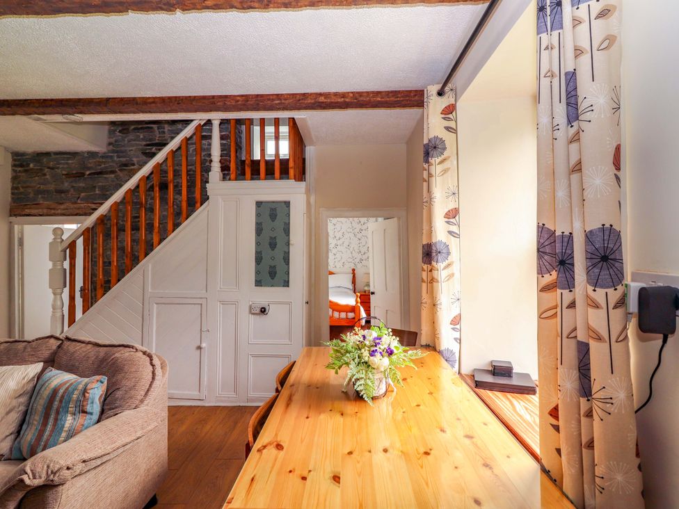A living room with a sofa and table at The Farmhouse in Tralee, County Kerry