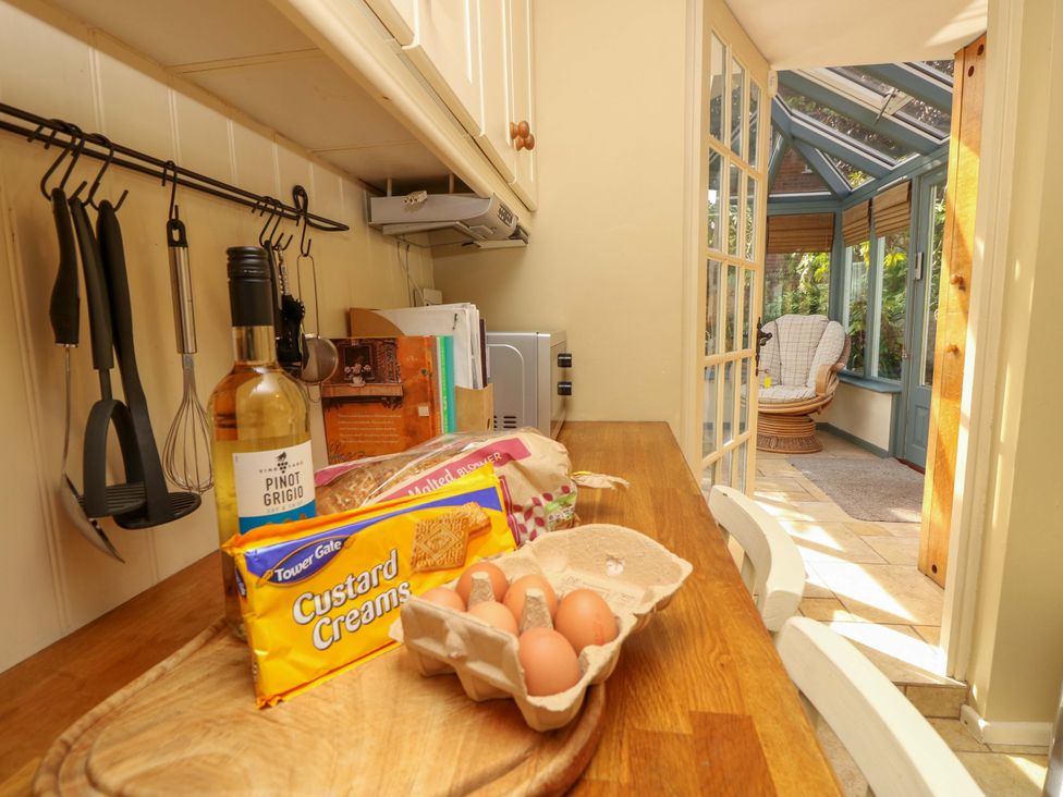 A kitchen with utensils and groceries at Smugglers Cottage in New Milton