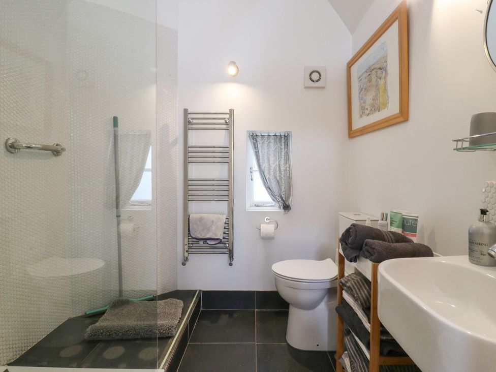 A bathroom with a shower and toilet at Little Barn @ Orwell