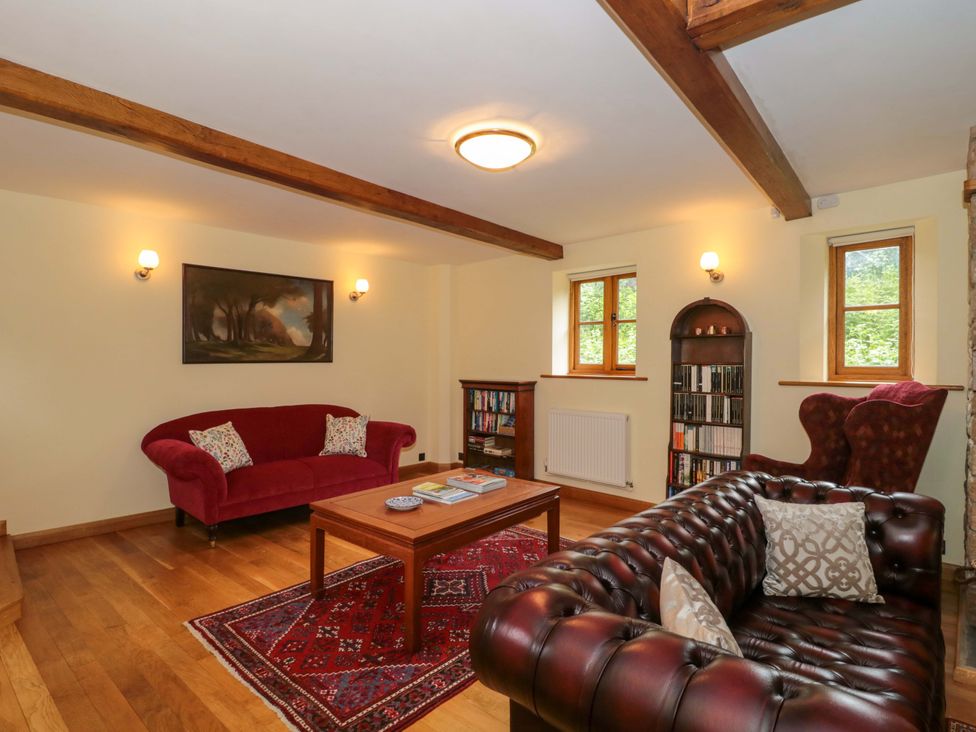A living room with sofas and a coffee table at Stowey Mead Stables in Bishop Sutton