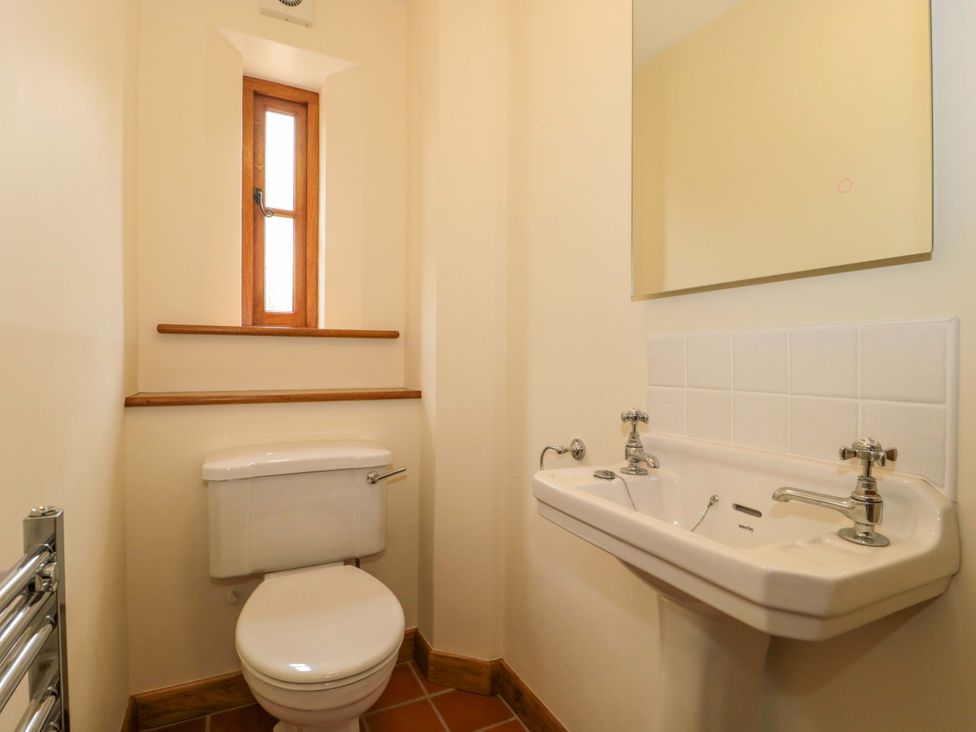 A bathroom with toilet and sink at Stowey Mead Stables in Bishop Sutton