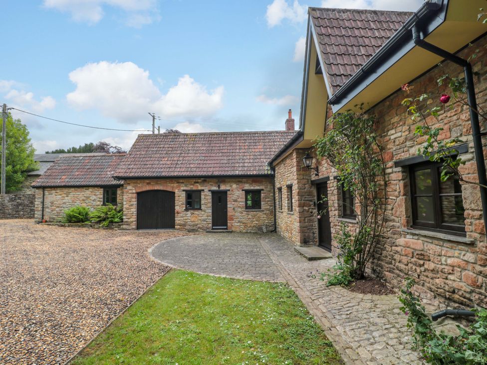 An outdoor area with a house and garden at Stowey Mead Stables Bishop Sutton
