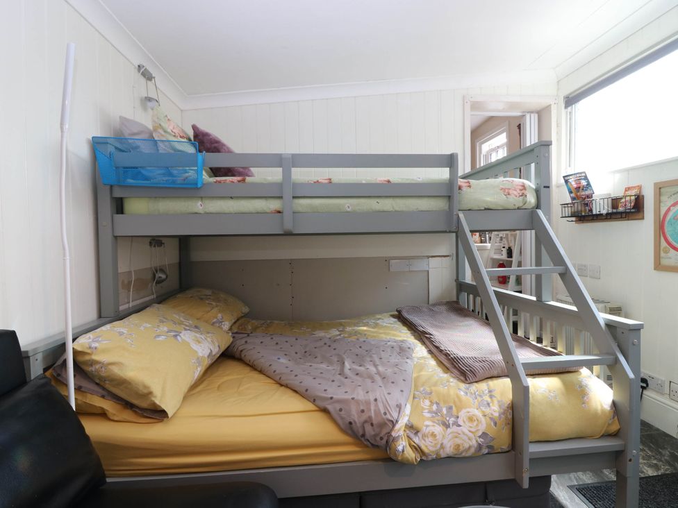 A bunk bed with a bottom and top mattress in a bedroom at The Cabin in East Wemyss near Buckhaven