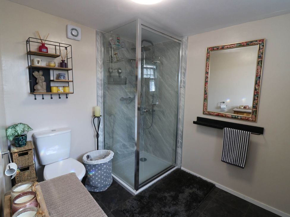 A bathroom with a shower and toilet at The Cabin in East Wemyss near Buckhaven