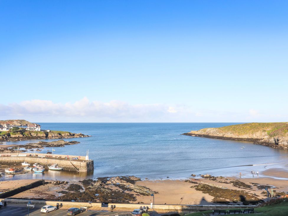 A view of the beach and sea at 2 Harbour Lights in Cemaes Bay