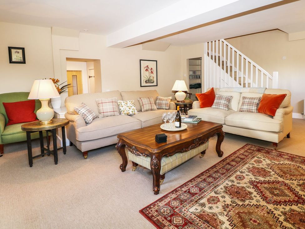 A living room with sofas and a coffee table at The Bothy in Wildboarclough