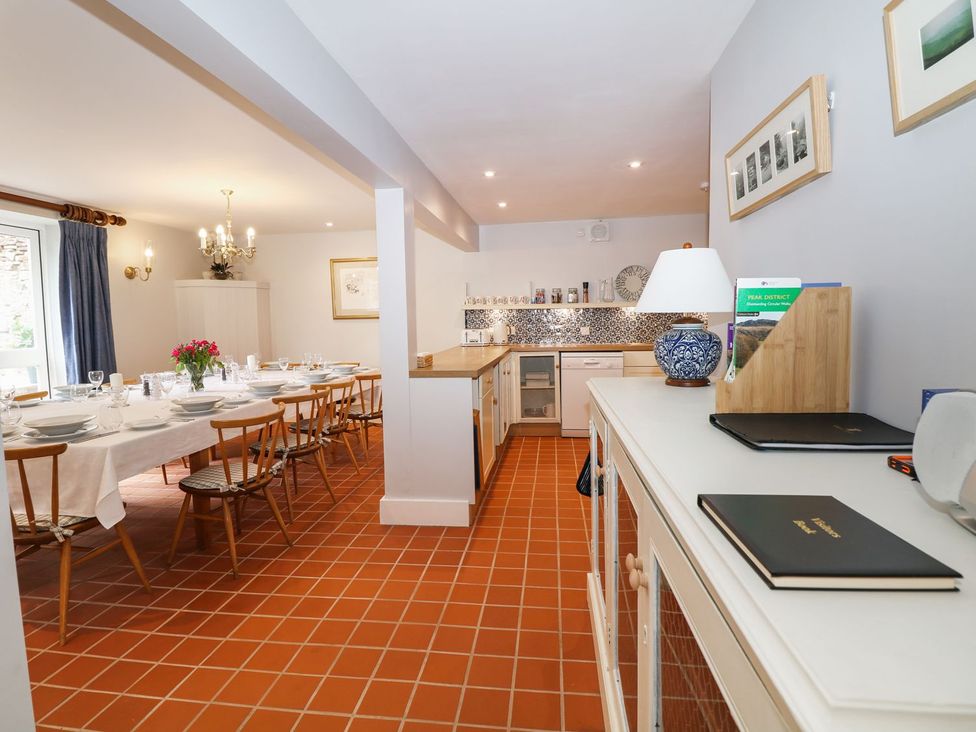 A dining room with a table set for meals at The Bothy in Wildboarclough