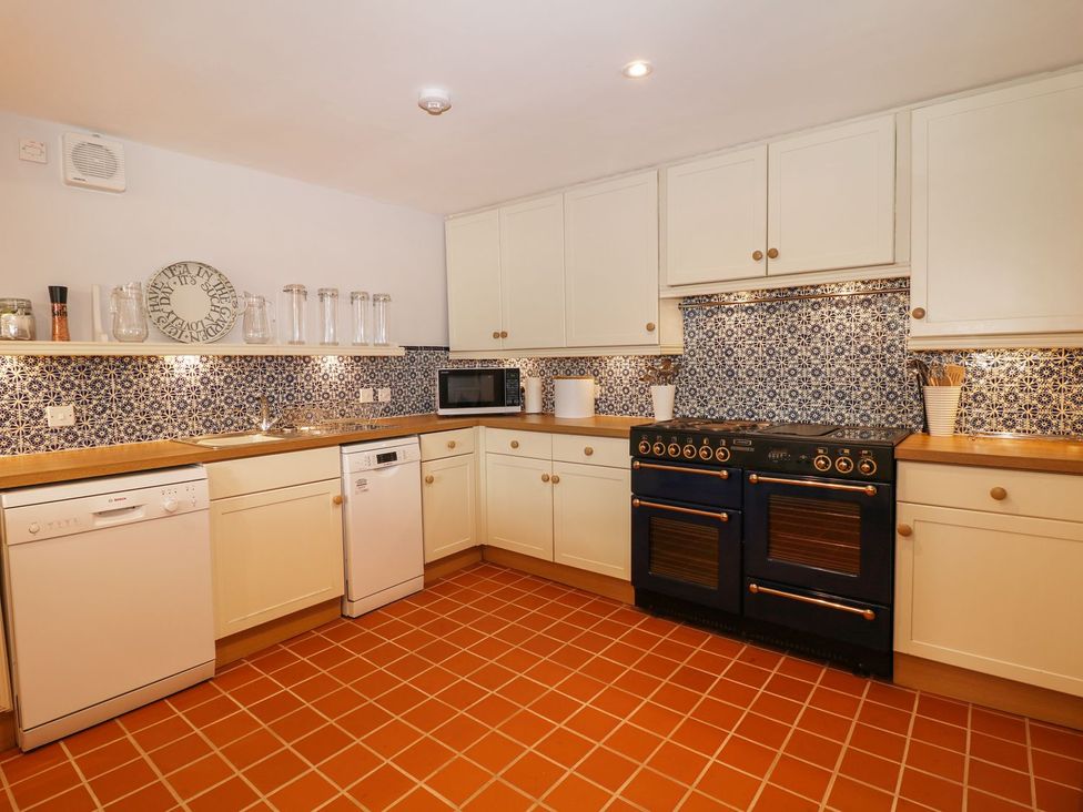 A kitchen with appliances and cabinets at The Bothy in Wildboarclough