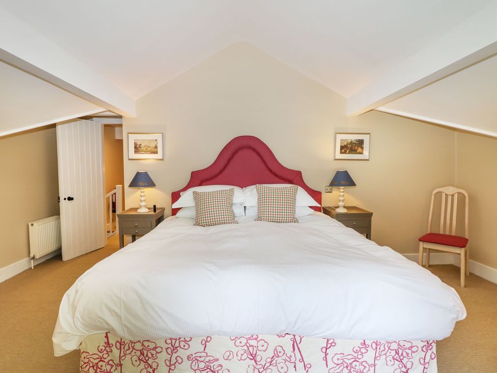A bedroom with a bed and nightstands at The Bothy in Wildboarclough