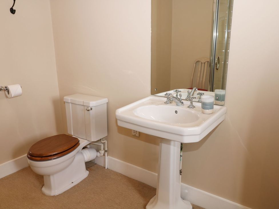 A bathroom with a sink and toilet at The Bothy in Wildboarclough