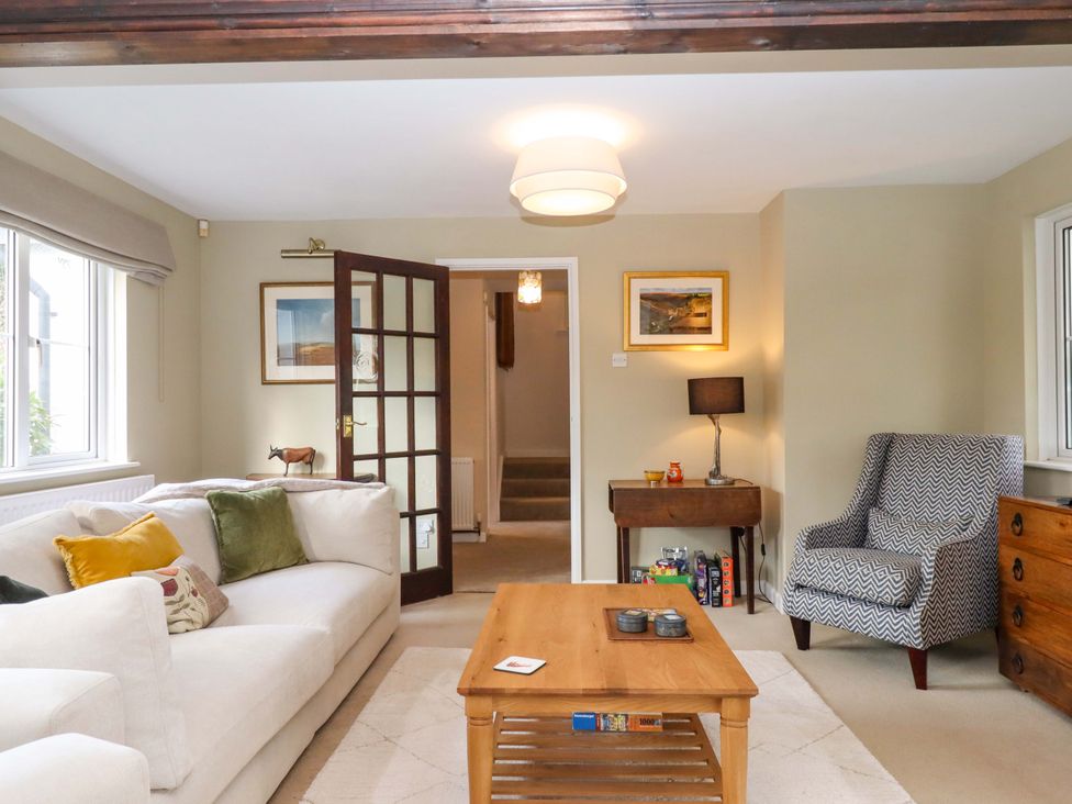A living room with a sofa and coffee table at Town Farm Cottage in Barnstaple