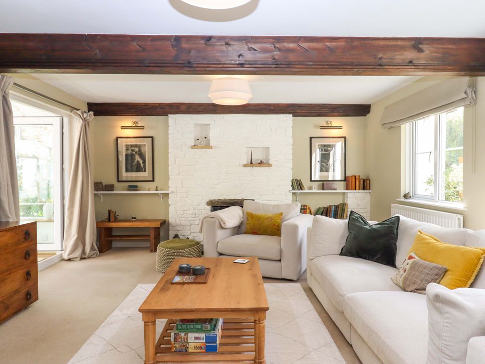 A living room with a sofa and coffee table at Town Farm Cottage in Barnstaple