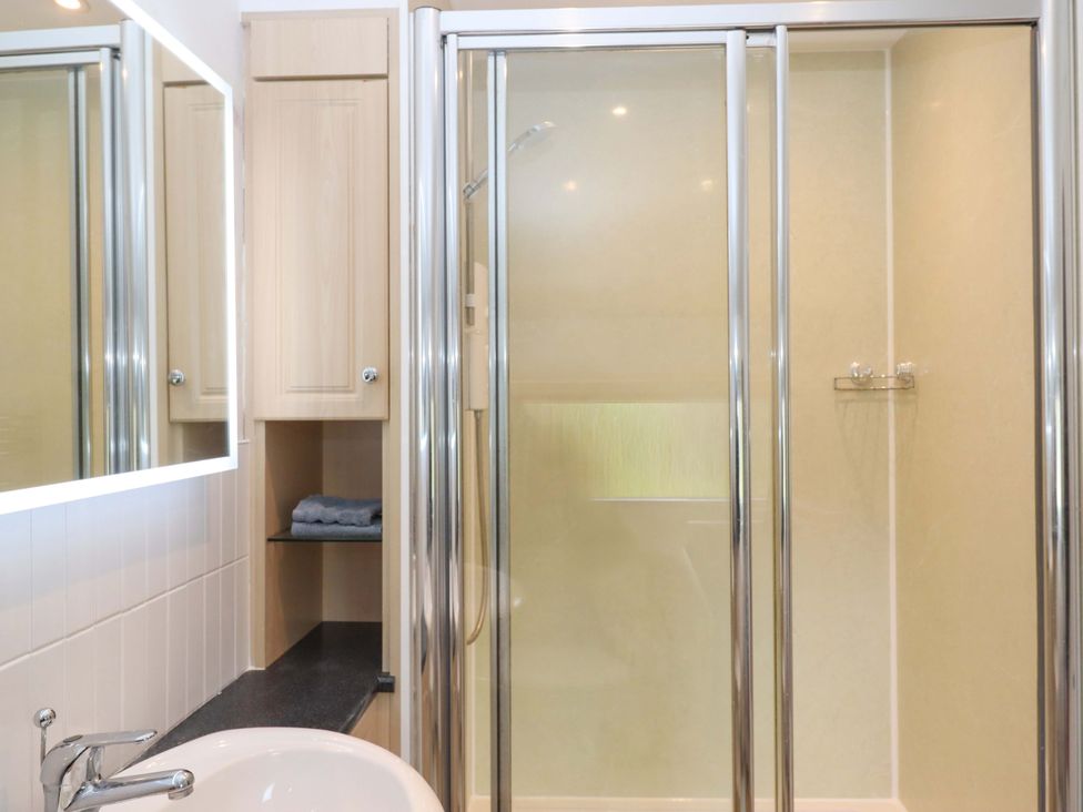 A bathroom with a shower and sink at Town Farm Cottage Barnstaple