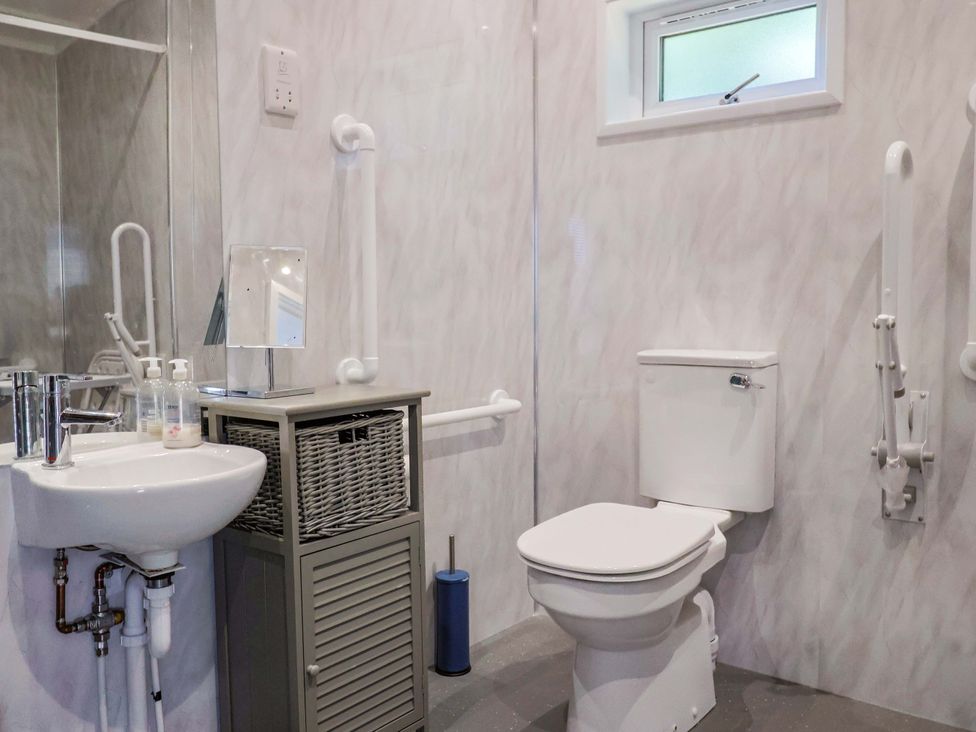 A bathroom with a sink and toilet at Cedar 1 in Pinewood Retreat in Rousdon near Lyme Regis