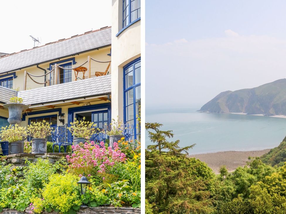 A house with flowers and a view of the ocean at Baywatch (St. David's View) in Lynton