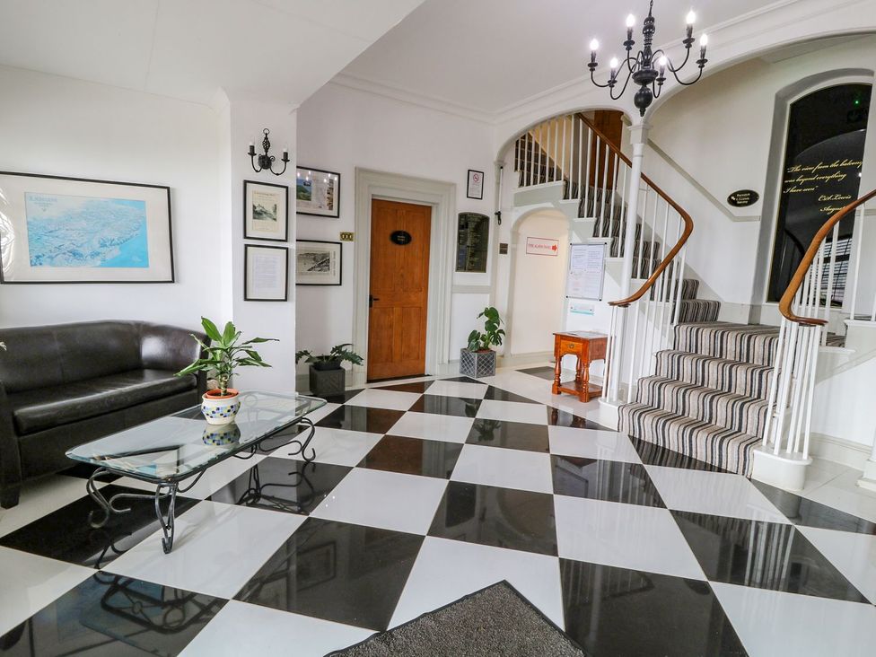 A lobby with a sofa and coffee table at Baywatch (St. David's View) Lynton