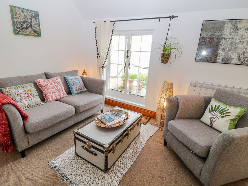 A living room with a coffee table and sofa at Baywatch (St. David's View) Lynton