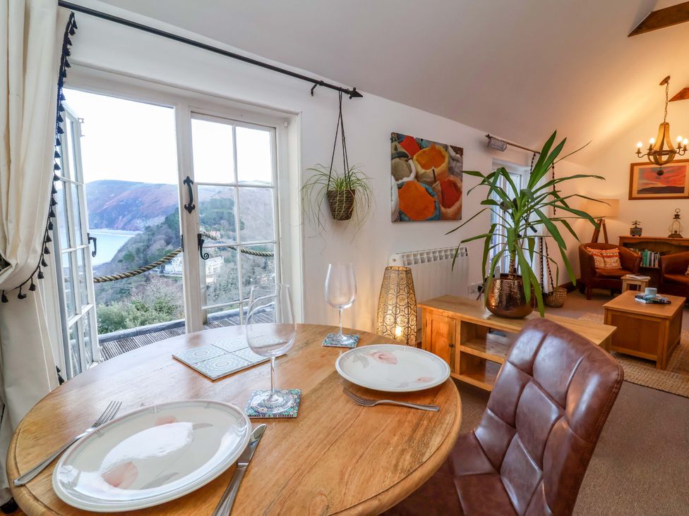 A dining room with a table and chairs at Baywatch (St. David's View) Lynton