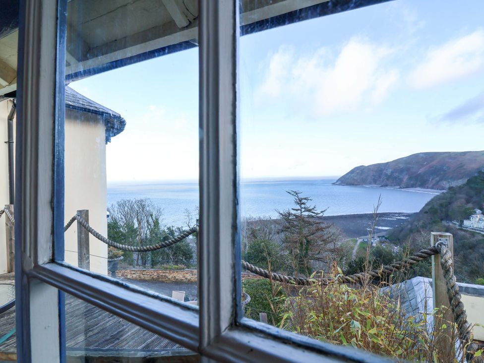 A view of the sea and coast from a window at Baywatch (St. David's View) Lynton