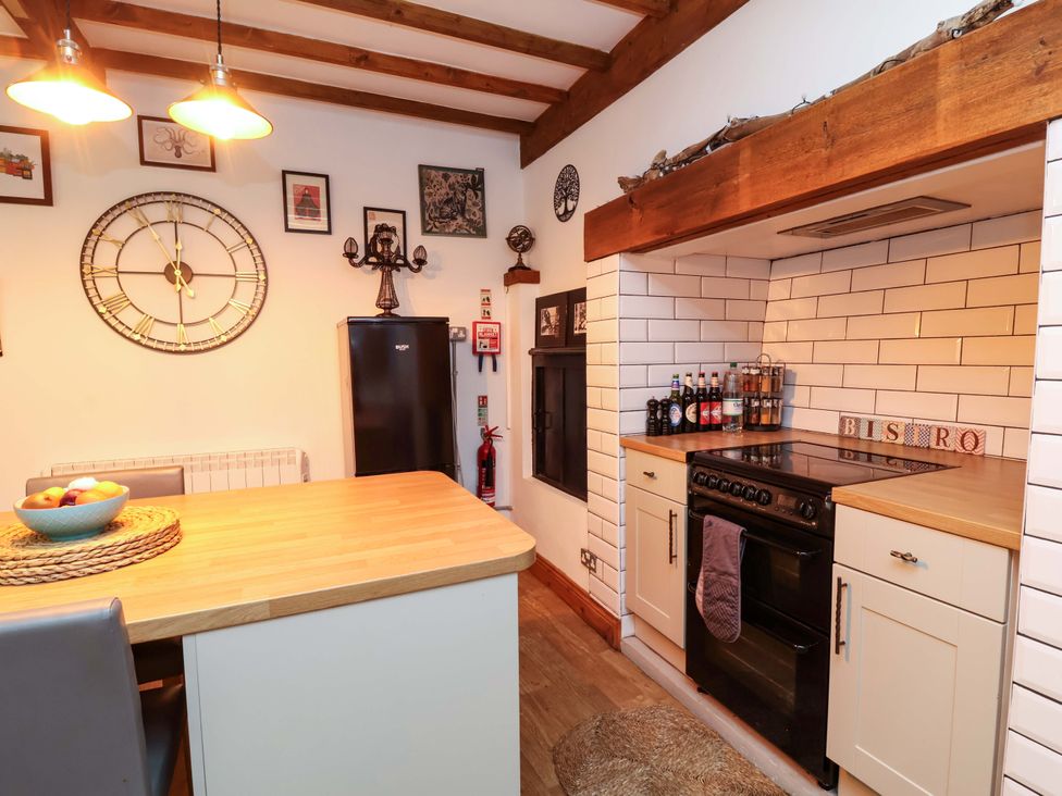 A kitchen with a refrigerator and stove at Baywatch (St. David's View) Lynton