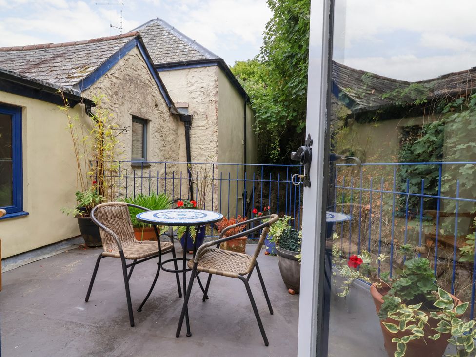 A patio area with a table and chairs at Baywatch (St. David's View) Lynton