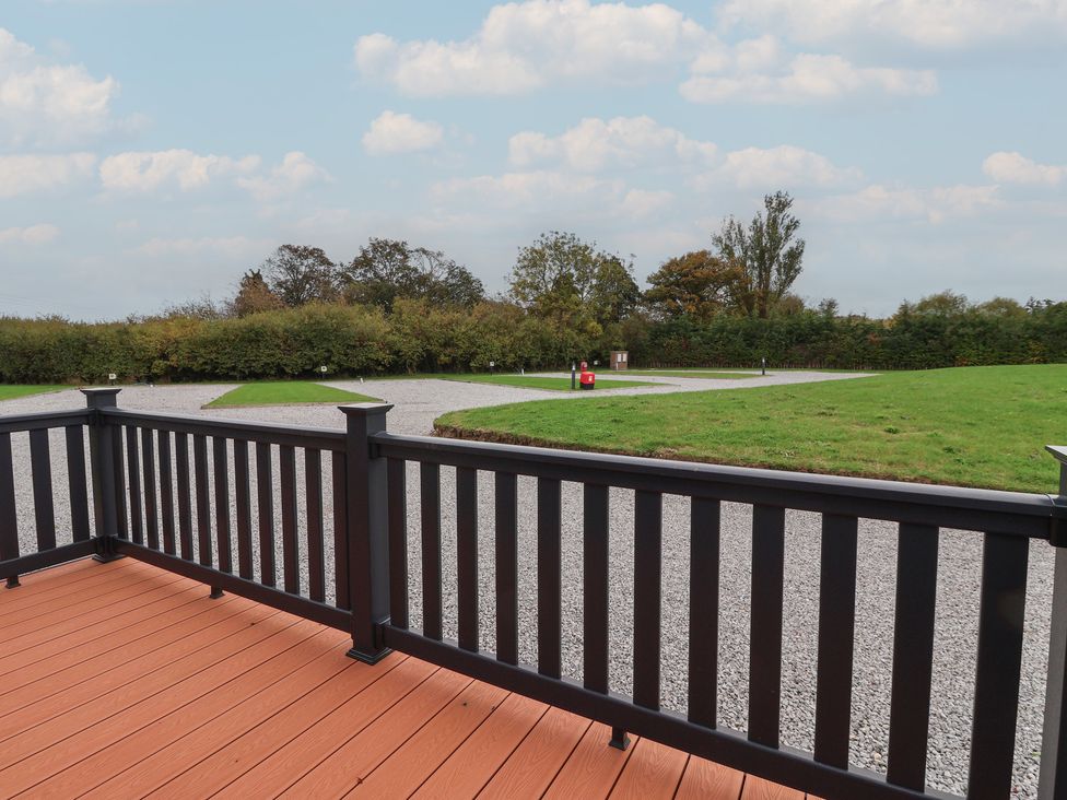 A view from a deck with grass and gravel paths at Meadows Park 2, Great Hatfield near Hornsea